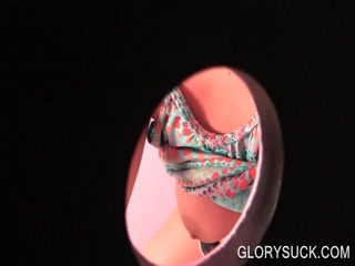 Hot chick making cock rock hard and sucking it on gloryhole