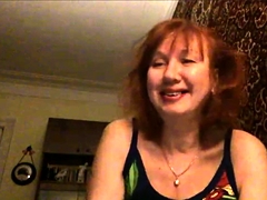 Mature Redhead Masturbates Solo On Leather Couch