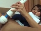 Asian girl rides a lesbian strap on