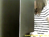 Dressing room hidden cam - Topless brunette with big boobs