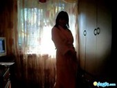 Arousing sweet Mila dances by the window
